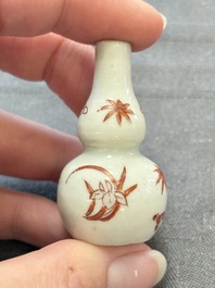 Eight Chinese wucai and gilt-iron-red miniature vases with floral design, Kangxi