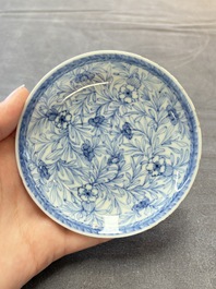 Ten Chinese blue and white cups and eleven saucers, Kangxi