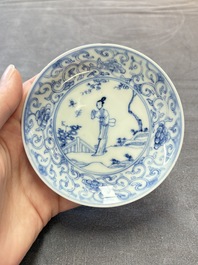 Ten Chinese blue and white cups and eleven saucers, Kangxi