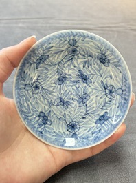 Ten Chinese blue and white cups and eleven saucers, Kangxi