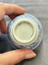 Ten Chinese blue and white cups and eleven saucers, Kangxi