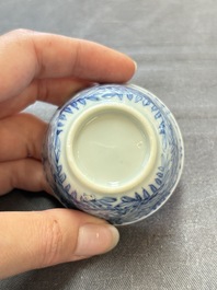 Ten Chinese blue and white cups and eleven saucers, Kangxi