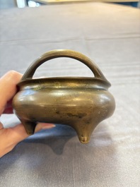 Two Chinese bronze tripod censers, Xuande marks, 19th C.