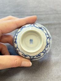 A set of six Chinese blue and white cups and saucers with floral design, Kangxi
