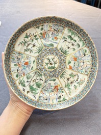 Three Chinese Canton famille verte plates and two famille rose wall pocket vases, 19th C.