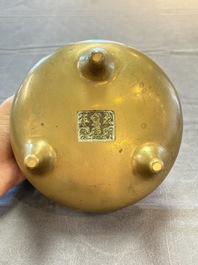 A Chinese bronze tripod censer, Xuande mark, 18th C.