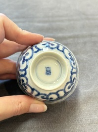 A set of six Chinese blue and white cups and saucers with floral design, Kangxi