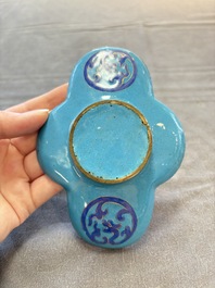 A pair of Chinese blue-ground Canton enamel covered bowls on stands and an egg cup, Qianlong/Jiaqing
