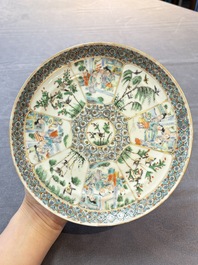 Three Chinese Canton famille verte plates and two famille rose wall pocket vases, 19th C.