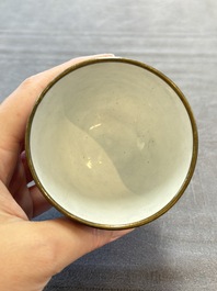 A pair of Chinese blue-ground Canton enamel covered bowls on stands and an egg cup, Qianlong/Jiaqing