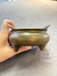 Two Chinese bronze tripod censers, Xuande marks, 19th C.
