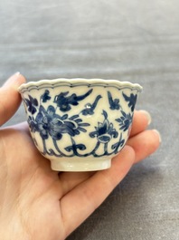 A set of six Chinese blue and white cups and saucers with floral design, Kangxi