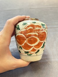Five Chinese wucai 'Buddhist lion' and 'peony scroll' jars, Transitional period