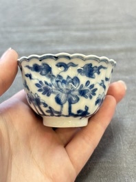 A set of six Chinese blue and white cups and saucers with floral design, Kangxi