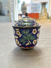 A pair of Chinese blue-ground Canton enamel covered bowls on stands and an egg cup, Qianlong/Jiaqing