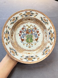 Four Chinese famille rose armorial plates and a dish, Qianlong
