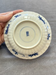 A set of six Chinese blue and white cups and saucers with floral design, Kangxi