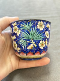 A pair of Chinese blue-ground Canton enamel covered bowls on stands and an egg cup, Qianlong/Jiaqing