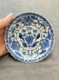 A set of six Chinese blue and white cups and saucers with floral design, Kangxi