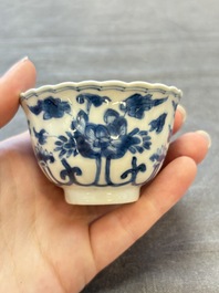 A set of six Chinese blue and white cups and saucers with floral design, Kangxi