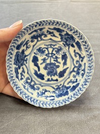 A set of six Chinese blue and white cups and saucers with floral design, Kangxi