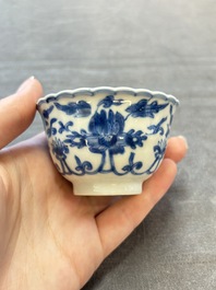A set of six Chinese blue and white cups and saucers with floral design, Kangxi