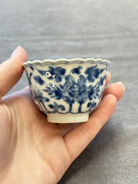 A set of six Chinese blue and white cups and saucers with floral design, Kangxi