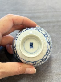 A set of six Chinese blue and white cups and saucers with floral design, Kangxi