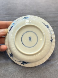 A set of six Chinese blue and white cups and saucers with floral design, Kangxi