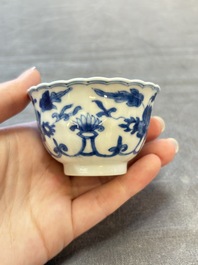 A set of six Chinese blue and white cups and saucers with floral design, Kangxi