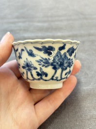 A set of six Chinese blue and white cups and saucers with floral design, Kangxi