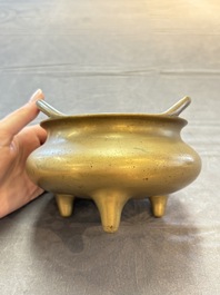 A Chinese bronze tripod censer, Xuande mark, 18th C.