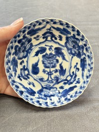 A set of six Chinese blue and white cups and saucers with floral design, Kangxi