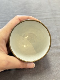 A pair of Chinese blue-ground Canton enamel covered bowls on stands and an egg cup, Qianlong/Jiaqing