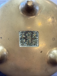A Chinese bronze tripod censer, Xuande mark, 18th C.