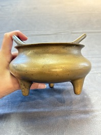A Chinese bronze tripod censer, Xuande mark, 18th C.