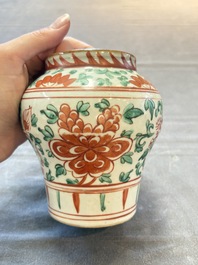Five Chinese wucai 'Buddhist lion' and 'peony scroll' jars, Transitional period