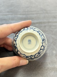 A set of six Chinese blue and white cups and saucers with floral design, Kangxi
