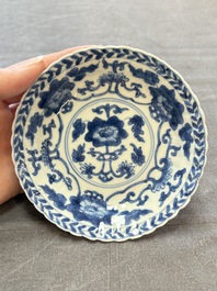 A set of six Chinese blue and white cups and saucers with floral design, Kangxi