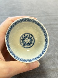 A set of six Chinese blue and white cups and saucers with floral design, Kangxi