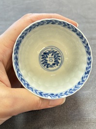 A set of six Chinese blue and white cups and saucers with floral design, Kangxi