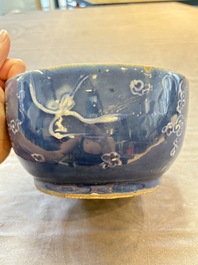 A rare Chinese Swatow white slip-decorated blue-ground bowl and cover, Ming