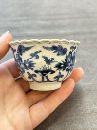 A set of six Chinese blue and white cups and saucers with floral design, Kangxi