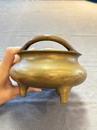 A Chinese bronze tripod censer, Xuande mark, 18th C.
