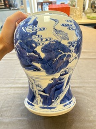 A Chinese blue and white 'He Lu Tong Chun 鶴鹿同春' vase and a wooden cover, Kangxi