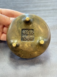 Two Chinese bronze tripod censers, Xuande marks, 19th C.