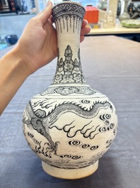 A Chinese black-enamelled biscuit 'dragon' vase, Kangxi mark, 19th C.