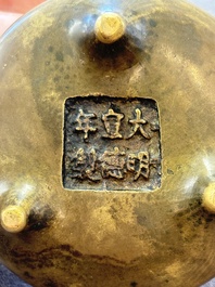 Two Chinese bronze tripod censers, Xuande marks, 19th C.
