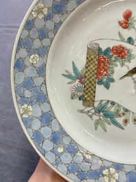 A Chinese famille rose ruby-back plate with a bird on a blossoming branch, Yongzheng