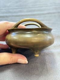 Two Chinese bronze tripod censers, Xuande marks, 19th C.